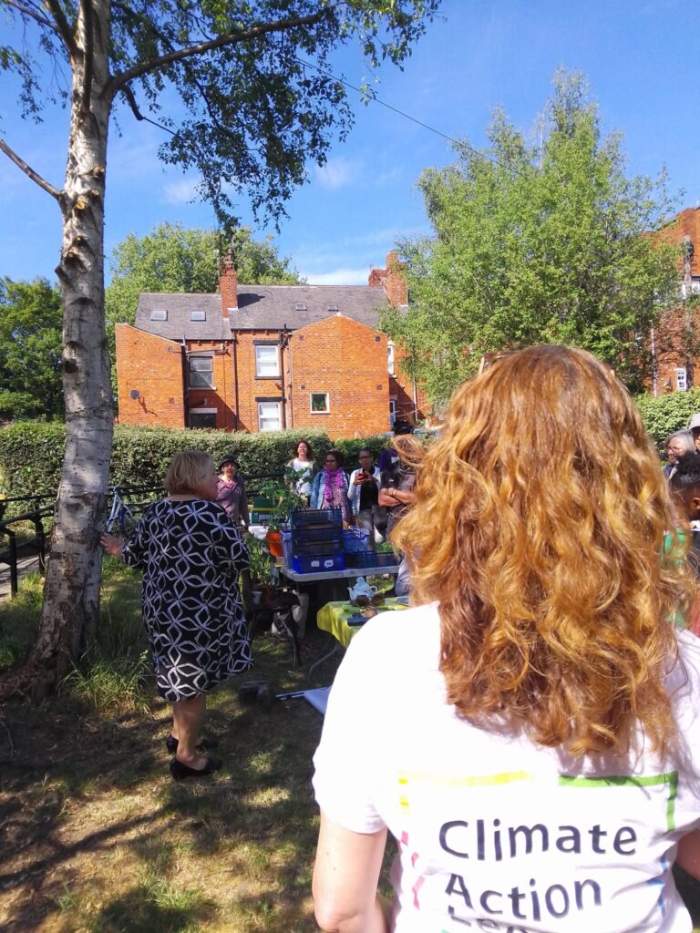 Roots of Change Leeds Caribbean and African centre Sonja Woodcock in a climate action leeds t shirt at leeds caribbean and african centre in leeds