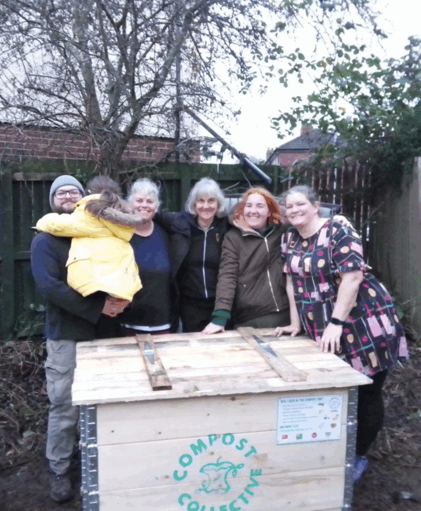 Killingbeck Orchard people by a compost bin