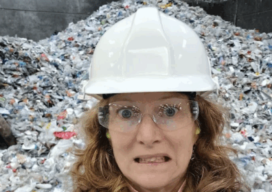 Sonja at MRF person in white hard hat recycling rubbish