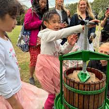 children juicing diverse heritage